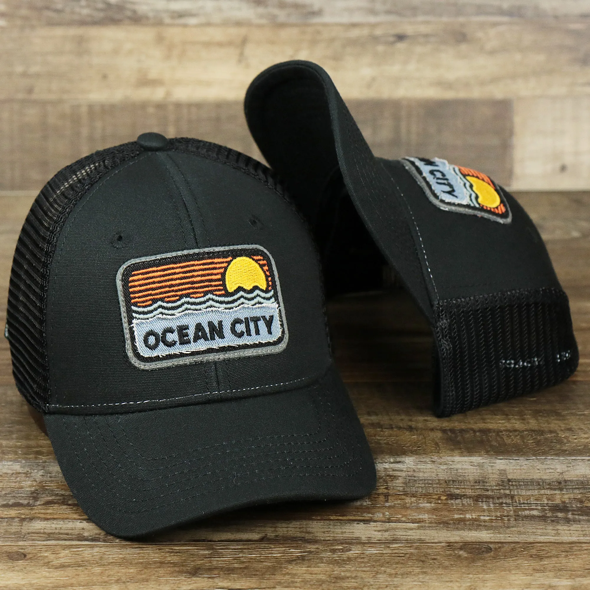 Youth New Jersey Ocean City Sunset Mesh Back Trucker Hat | Black And Black Mesh Youth Trucker Hat