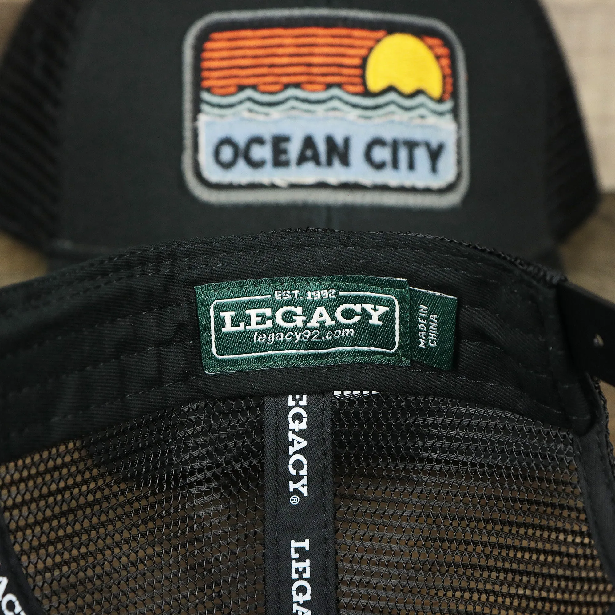 Youth New Jersey Ocean City Sunset Mesh Back Trucker Hat | Black And Black Mesh Youth Trucker Hat